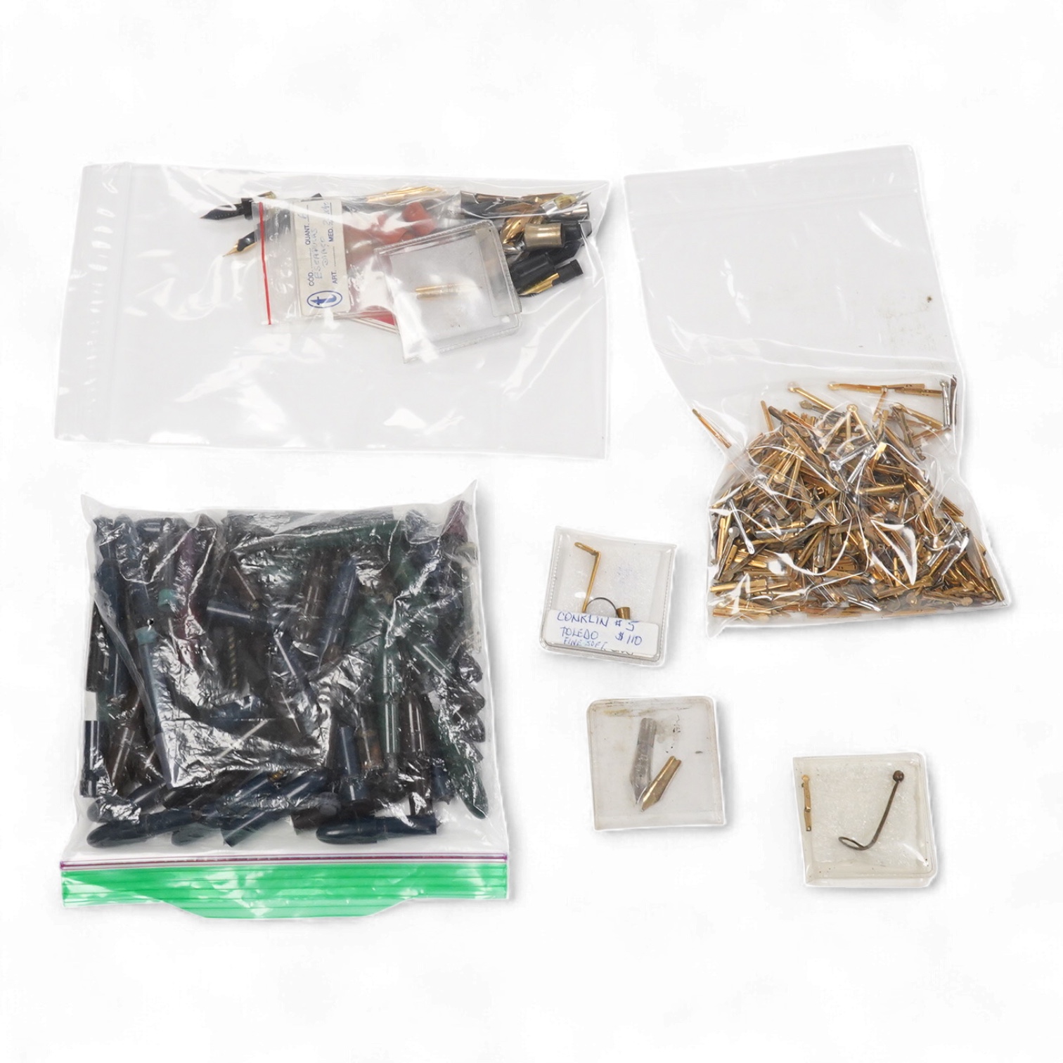 A selection of fountain spares to include levers, blind caps and nibs, some gold